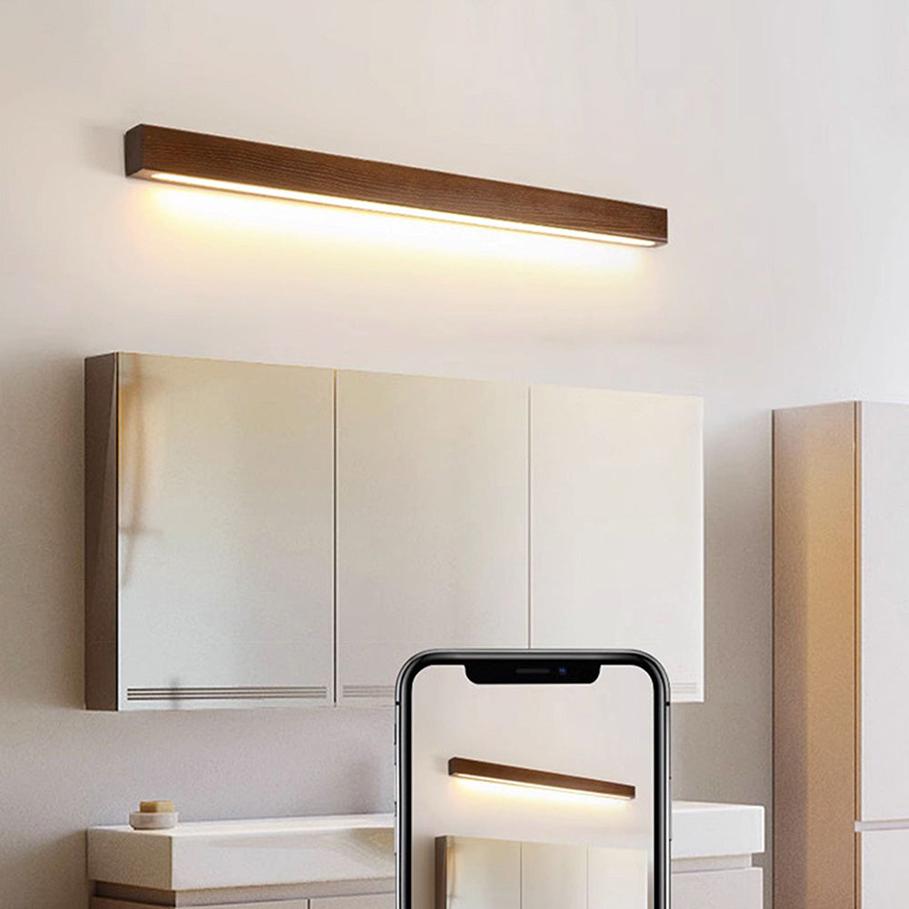 wood bathroom wall light, mirror wall light, LED bathroom lighting, natural wood sconce, minimalist wall light, wooden vanity light, modern bathroom fixture, bathroom light with mirror, cozy bathroom lighting, hardwired wood light, acrylic wall lamp, warm tone lighting, rustic bathroom wall light, functional bathroom sconce, CE certified wall light